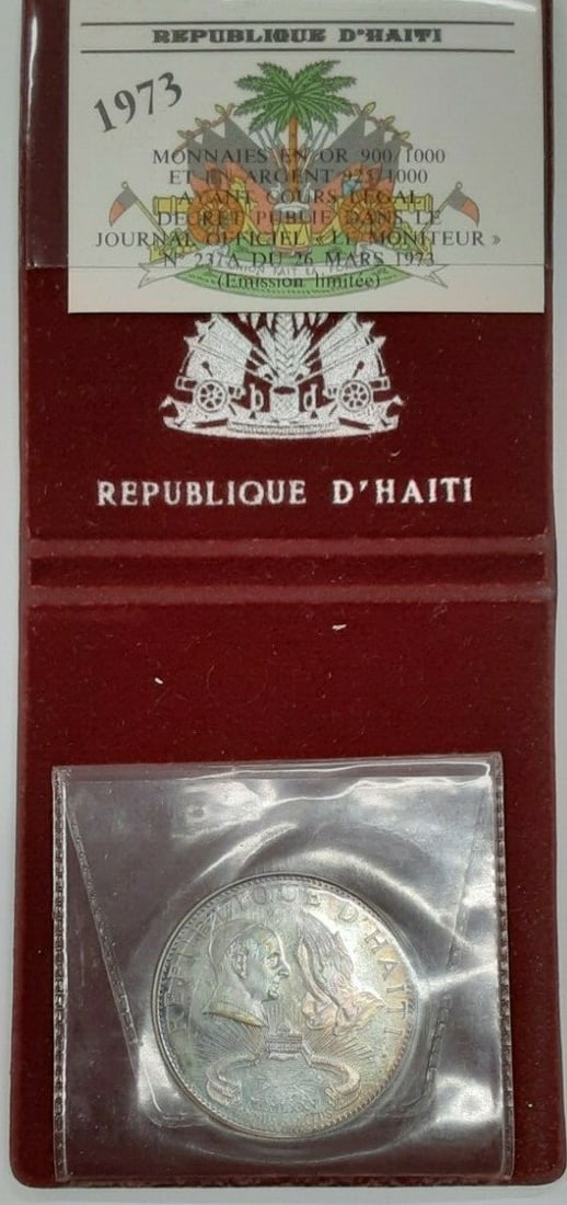 1974 Haiti 50 Gourdes Holy Year Silver Coin in Original Case: 1974 Haiti 50 Gourdes Holy Year Silver Coin in Original Case This 1974 Haiti 50 Gourdes "Holy Year" silver coin is a remarkable collectible piece, featuring a denomination of 50 Gourdes. It is made of