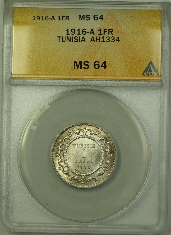 1916-A Tunisia 1 Franc Coin ANACS MS 64 KM#238: 1916-A Tunisia 1 Franc Coin ANACS MS 64 KM#238 This 1916-A Tunisia AH1334 1 Franc Coin is a remarkable piece of numismatic history, certified by ANACS with a grade of MS 64. The coin showcases the int