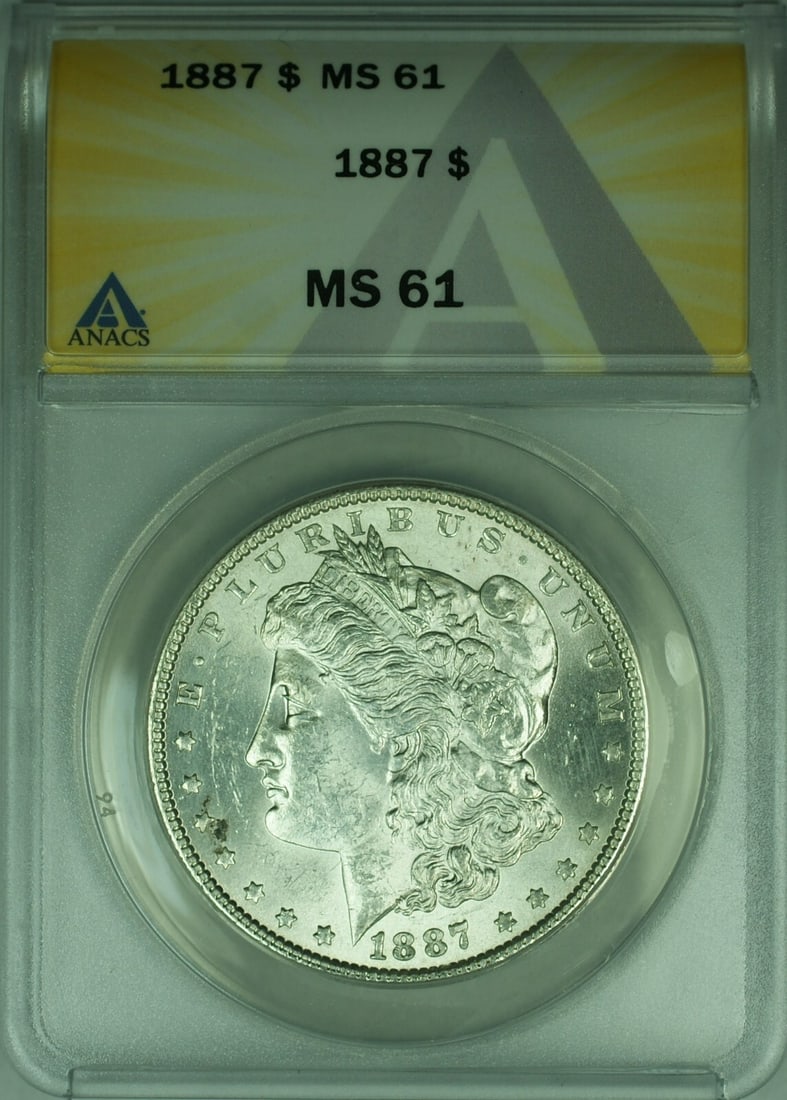 1887 Morgan Silver Dollar ANACS MS61 Uncirculated Coin: 1887 Morgan Silver Dollar ANACS MS61 Uncirculated Coin This 1887 Morgan Silver Dollar is a remarkable addition to any numismatic collection. Graded MS-61 by ANACS, this uncirculated coin features a co