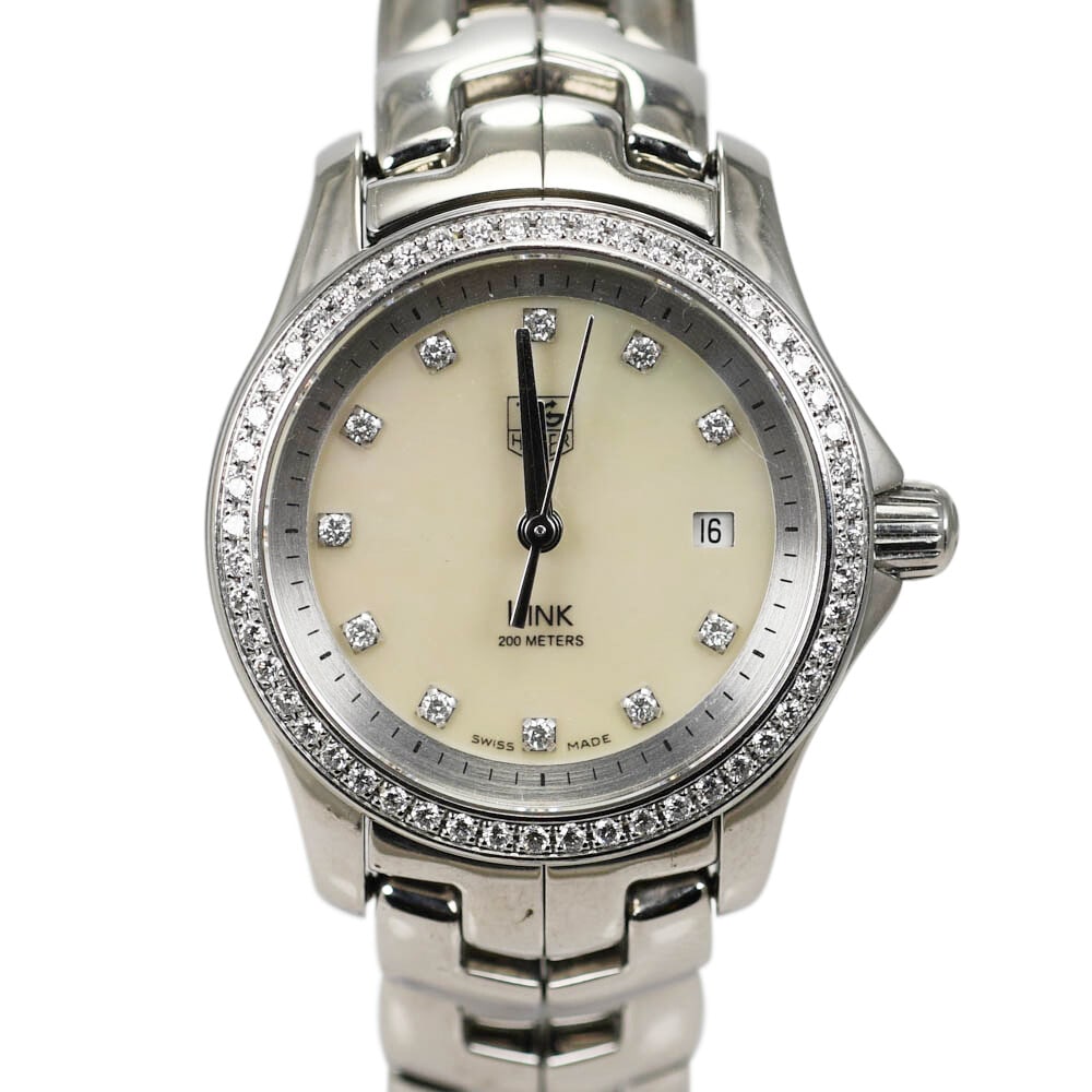 TAG Heuer Link Ladies Wristwatch Diamond Bezel Mother of Pearl Dial: TAG Heuer Link Ladies Wristwatch Diamond Bezel Mother of Pearl Dial This elegant TAG Heuer Link wristwatch features a stunning diamond bezel and dial, perfect for adding a touch of luxury to any outfi