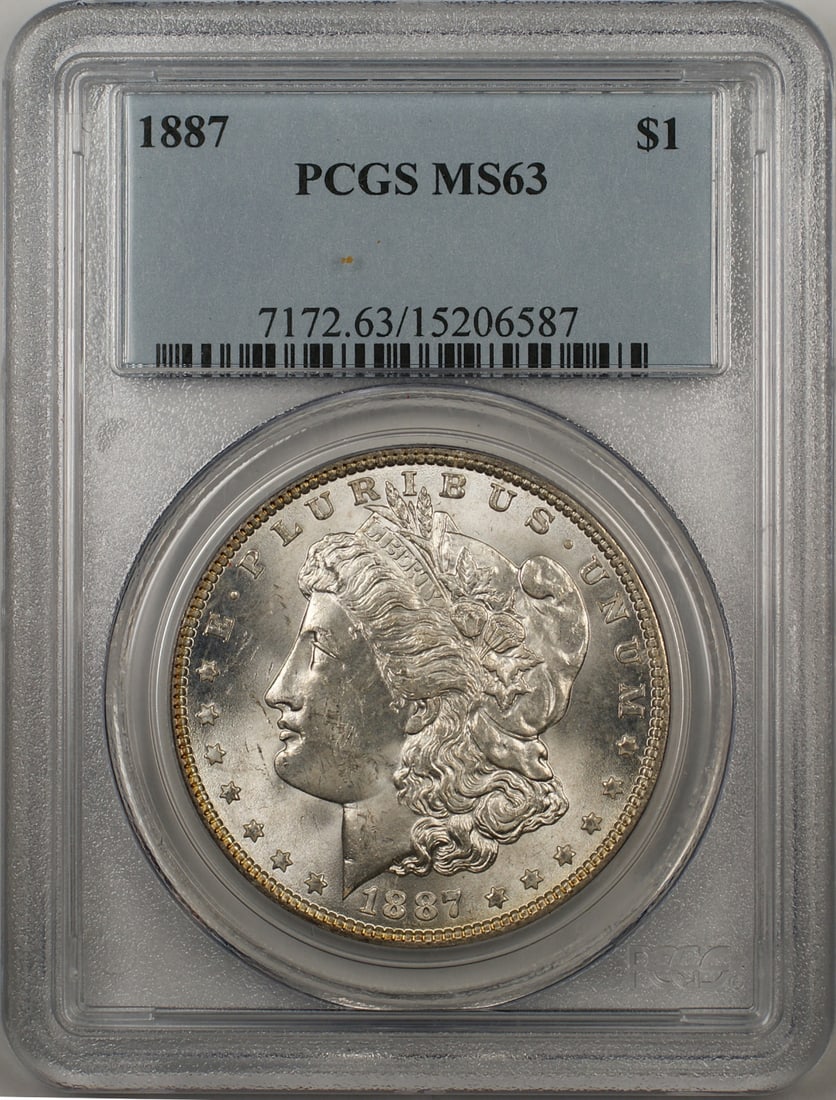 1887 Morgan Silver Dollar Coin PCGS MS 63 Philadelphia Silver: 1887 Morgan Silver Dollar Coin PCGS MS 63 Philadelphia Silver This 1887 Morgan Silver Dollar coin is a stunning piece of history, certified by PCGS with a grade of MS 63. It was minted in Philadelphia
