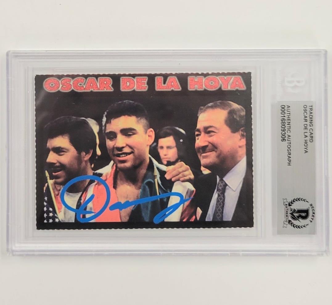 Oscar De La Hoya 1997 Signed Trading Card Beckett BAS Authenticated: Oscar De La Hoya 1997 Signed Trading Card Beckett BAS Authenticated This is a vintage 1997 trading card featuring the boxing legend Oscar De La Hoya. The card is hard signed and comes authenticated by