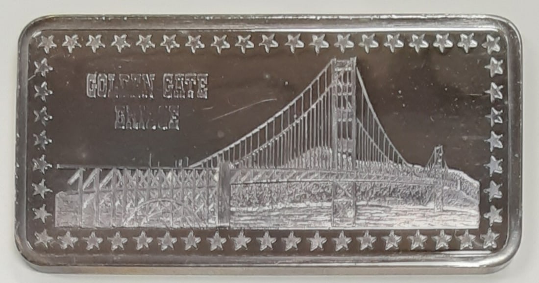 Hamilton Mint Golden Gate Bridge 1 Troy Oz .999 Silver Bar: Hamilton Mint Golden Gate Bridge 1 Troy Oz .999 Silver Bar This stunning Hamilton Mint silver bar features the iconic Golden Gate Bridge, crafted from .999 fine silver. With a weight of 1 troy oz, thi
