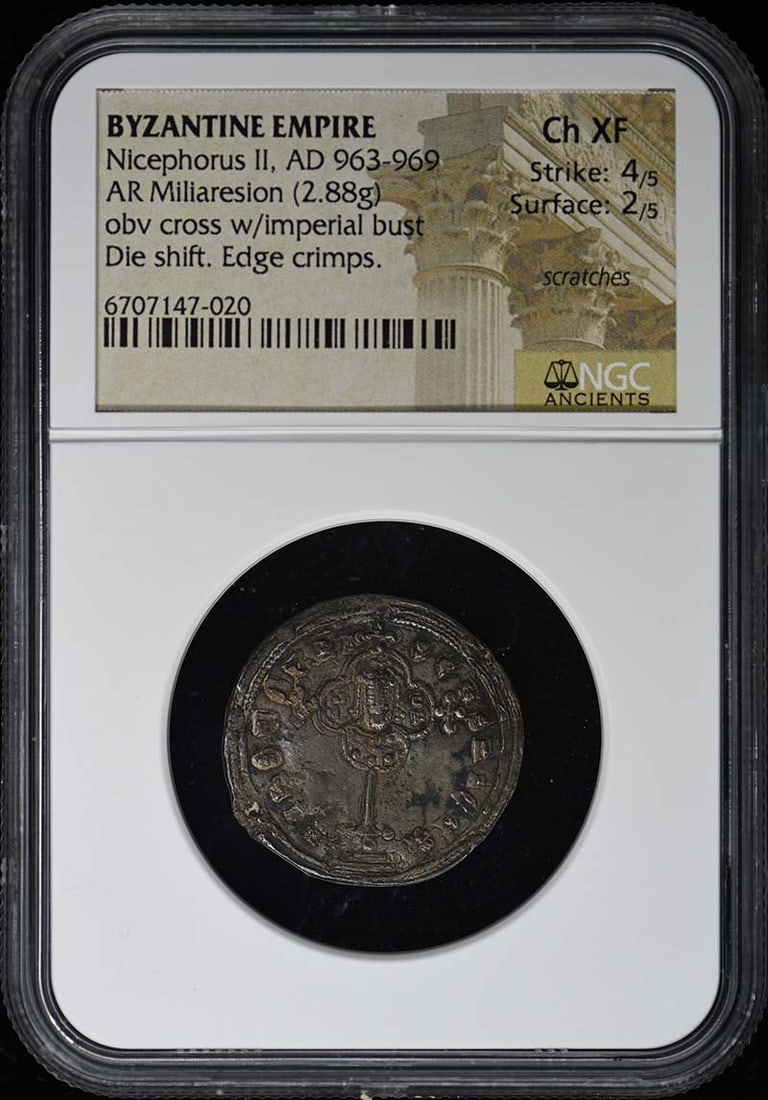 Nicephorus II Byzantine AR Miliaresion NGC XF45 Coin AD 963-969: Nicephorus II Byzantine AR Miliaresion NGC XF45 Coin AD 963-969 This Byzantine AR Miliaresion, issued during the reign of Nicephorus II from AD 963-969, is a remarkable historical coin. Certified by N