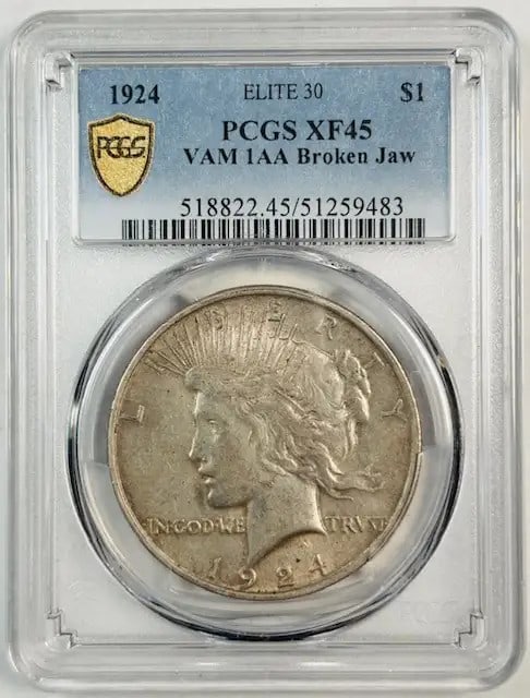 1924 Peace Dollar PCGS XF45 VAM 1AA RARE Broken Jaw: 1924 Peace Dollar PCGS XF45 VAM 1AA RARE Broken Jaw This 1924 Peace Dollar is a remarkable piece of numismatic history, certified by PCGS at an XF-45 grade. Struck in silver, this coin features the di