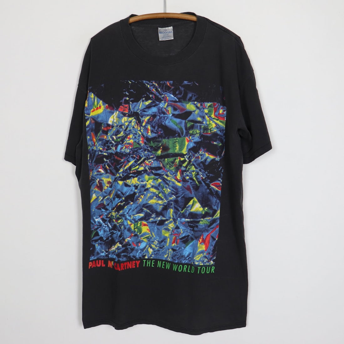 Vintage 1993 Paul McCartney New World Tour Shirt Black 100% Cotton: Vintage 1993 Paul McCartney New World Tour Shirt Black 100% Cotton Step back into the 1990s with this original vintage 1993 Paul McCartney New World Tour Shirt. This authentic collectible features str