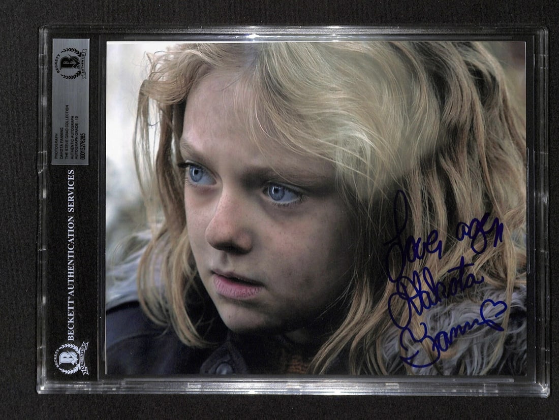 Dakota Fanning Autographed 8x10 Photo BAS Grade 10 Man on Fire: Dakota Fanning Autographed 8x10 Photo BAS Grade 10 Man on Fire This is an autographed 8x10 color photograph of Dakota Fanning from the movie 'Man on Fire'. The signature has been written in blue perma