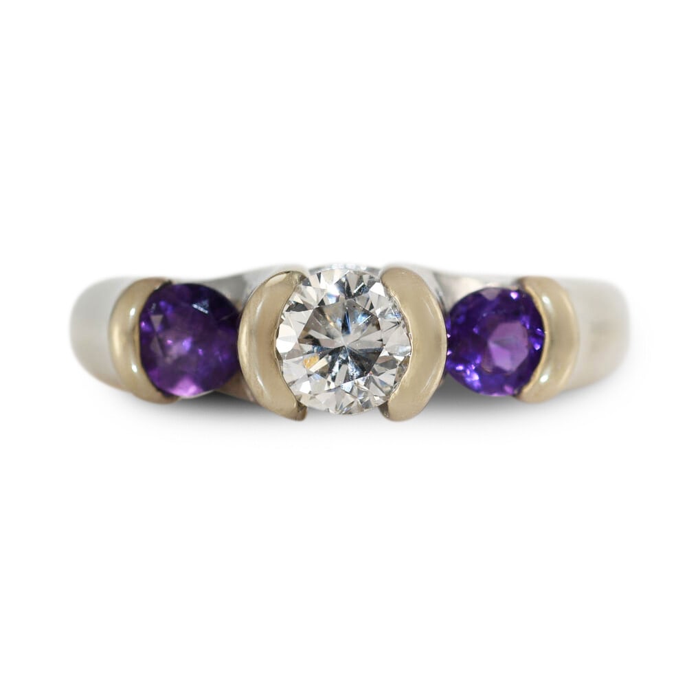 14K White Gold Diamond Amethyst Ring 0.50ct G-H I1 Size 7: 14K White Gold Diamond Amethyst Ring 0.50ct G-H I1 Size 7 This elegant 14K white gold ring features a stunning natural diamond center stone weighing 0.50 carats, graded G-H in color and I1 in clarity.