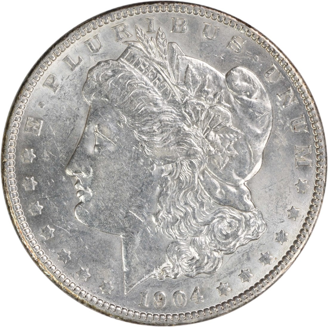 1904 Morgan Dollar 90 Percent Silver Philadelphia AU Uncertified Coin: 1904 Morgan Dollar 90 Percent Silver Philadelphia AU Uncertified Coin This 1904 Morgan Silver Dollar was minted in Philadelphia and is composed of 90% silver and 10% copper. Designed by George T. Morg