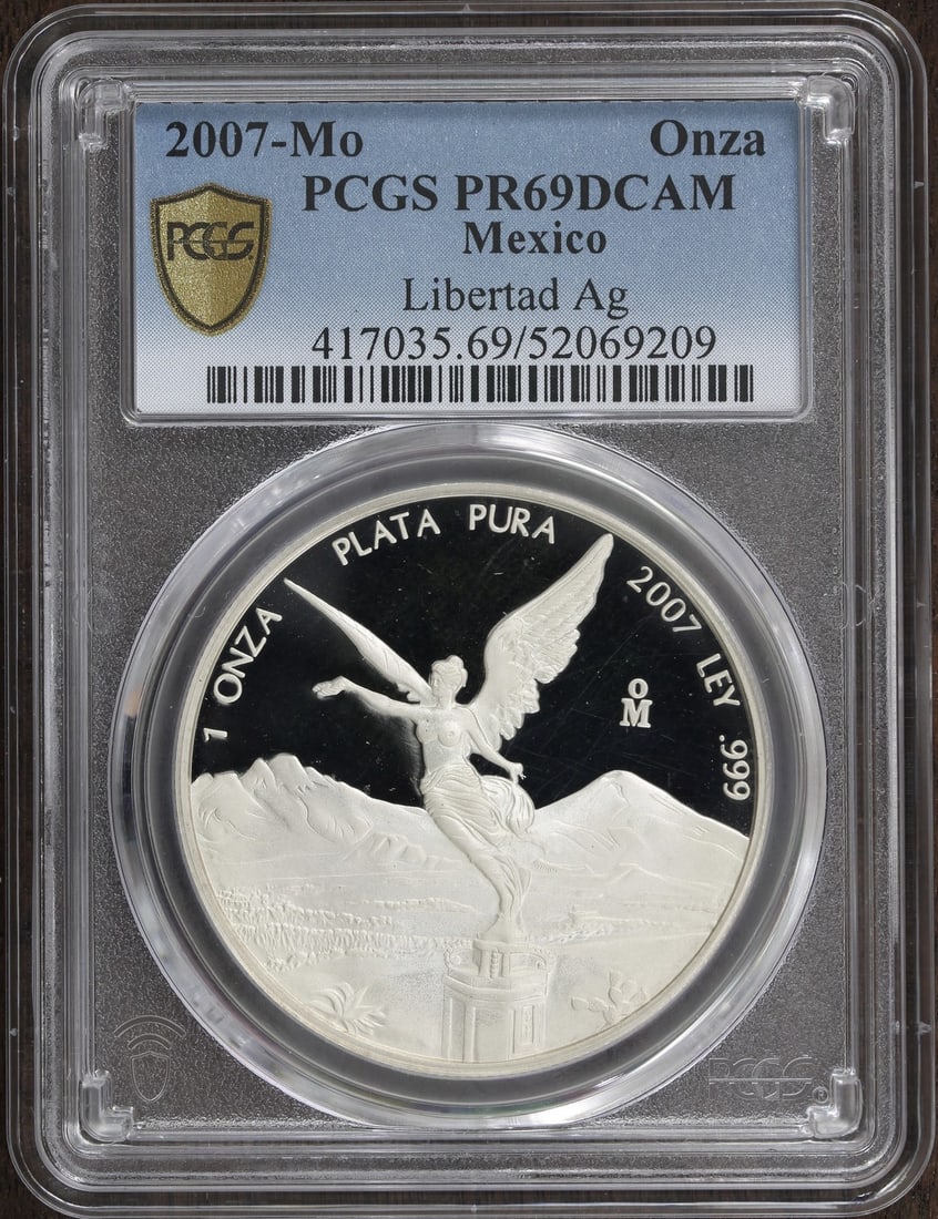 2007 Mexico Libertad Silver 1 oz Proof Coin PR69 DCAM PCGS: 2007 Mexico Libertad Silver 1 oz Proof Coin PR69 DCAM PCGS This stunning 2007 Mexican Libertad coin features a 1 oz silver composition with a remarkable Proof finish. Graded PR 69 by PCGS, it boasts a