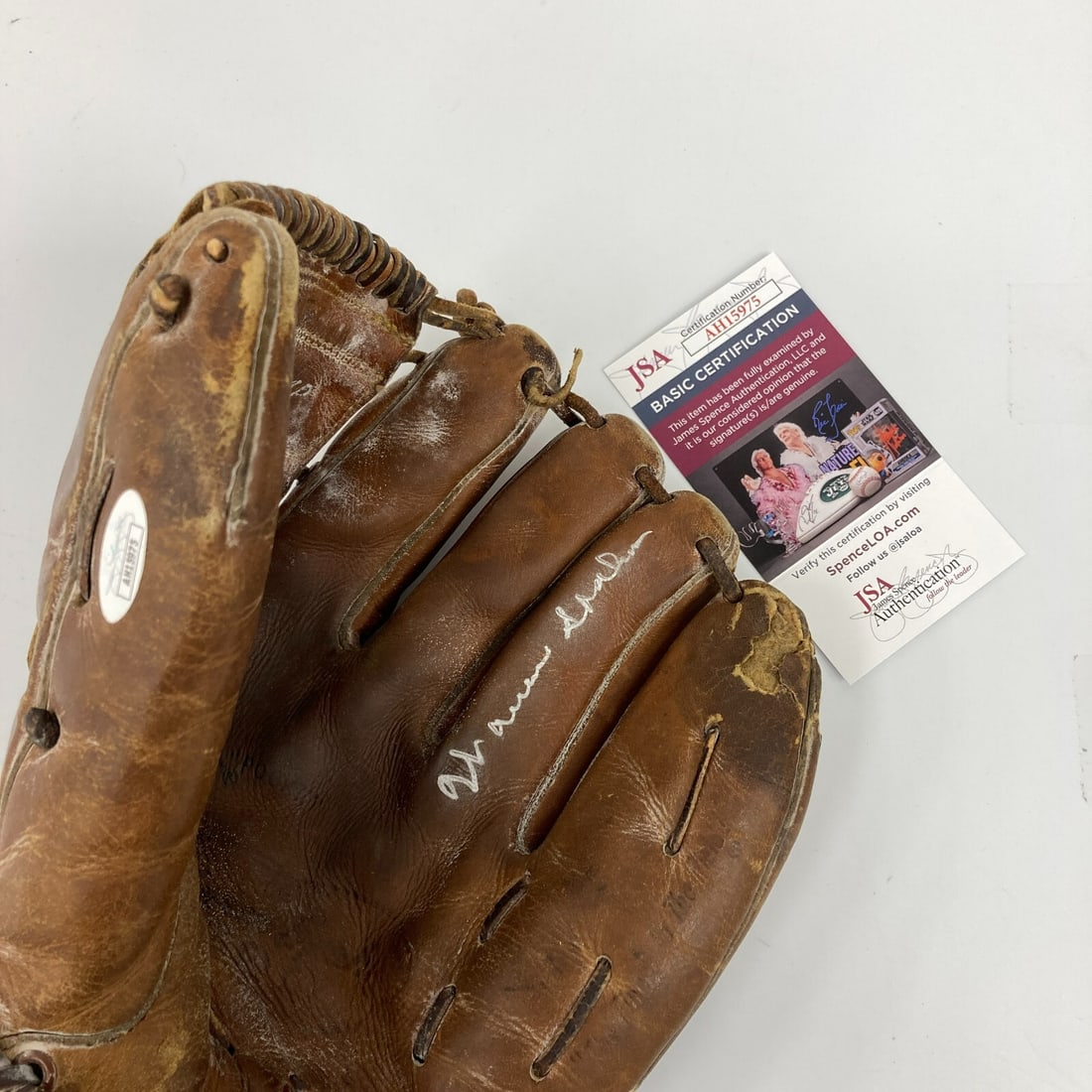 Warren Spahn Signed 1950s Rawlings Baseball Glove with JSA COA: Warren Spahn Signed 1950s Rawlings Baseball Glove with JSA COA This is a pre-owned 1950's Rawlings game model baseball glove signed by Hall of Fame pitcher Warren Spahn. The glove is authenticated by