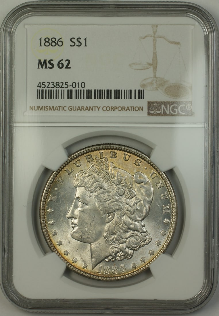 1886 NGC MS62 Morgan Silver Dollar Lightly Toned Coin: 1886 NGC MS62 Morgan Silver Dollar Lightly Toned Coin This 1886 Morgan Silver Dollar is a remarkable piece, graded MS-62 by NGC, ensuring its quality as an uncirculated coin. The coin, minted in Phila