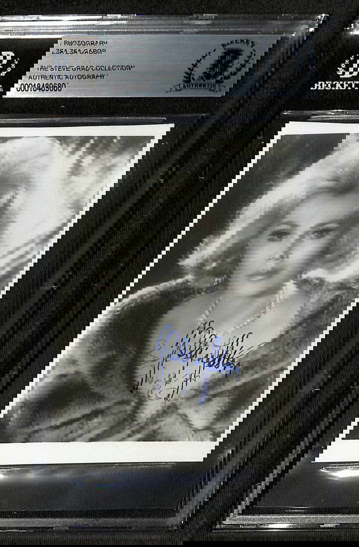 Zsa Zsa Gabor 5x7 Signed Photo with BECKETT Authentication: Zsa Zsa Gabor 5x7 Signed Photo with BECKETT Authentication This stunning 5x7 black and white vintage photograph captures Hollywood icon Zsa Zsa Gabor (1917-2016), showcasing her elegance and timeless