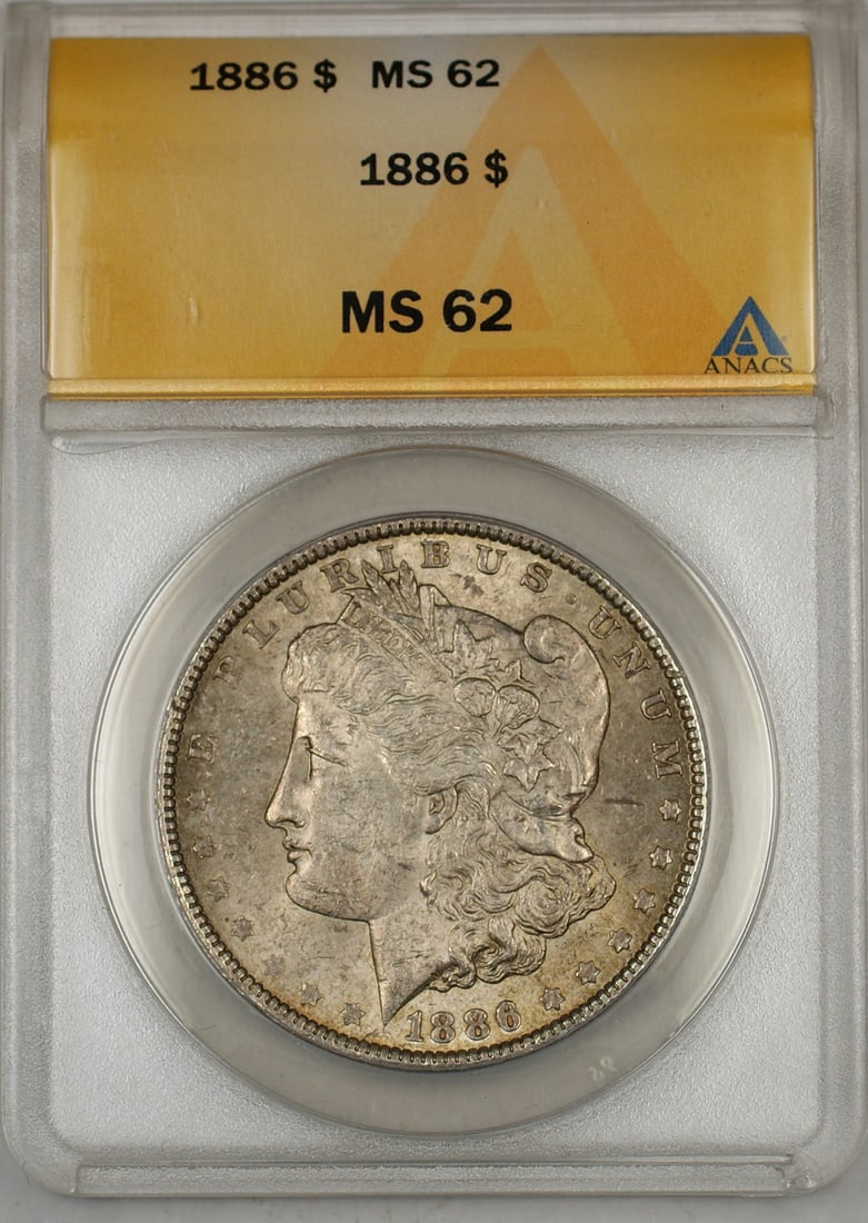 1886 Morgan Silver Dollar Coin ANACS MS-62 Toned Uncirculated: 1886 Morgan Silver Dollar Coin ANACS MS-62 Toned Uncirculated This 1886 Morgan Silver Dollar is a remarkable piece, certified by ANACS with a grade of MS 62, indicating its uncirculated condition. Min