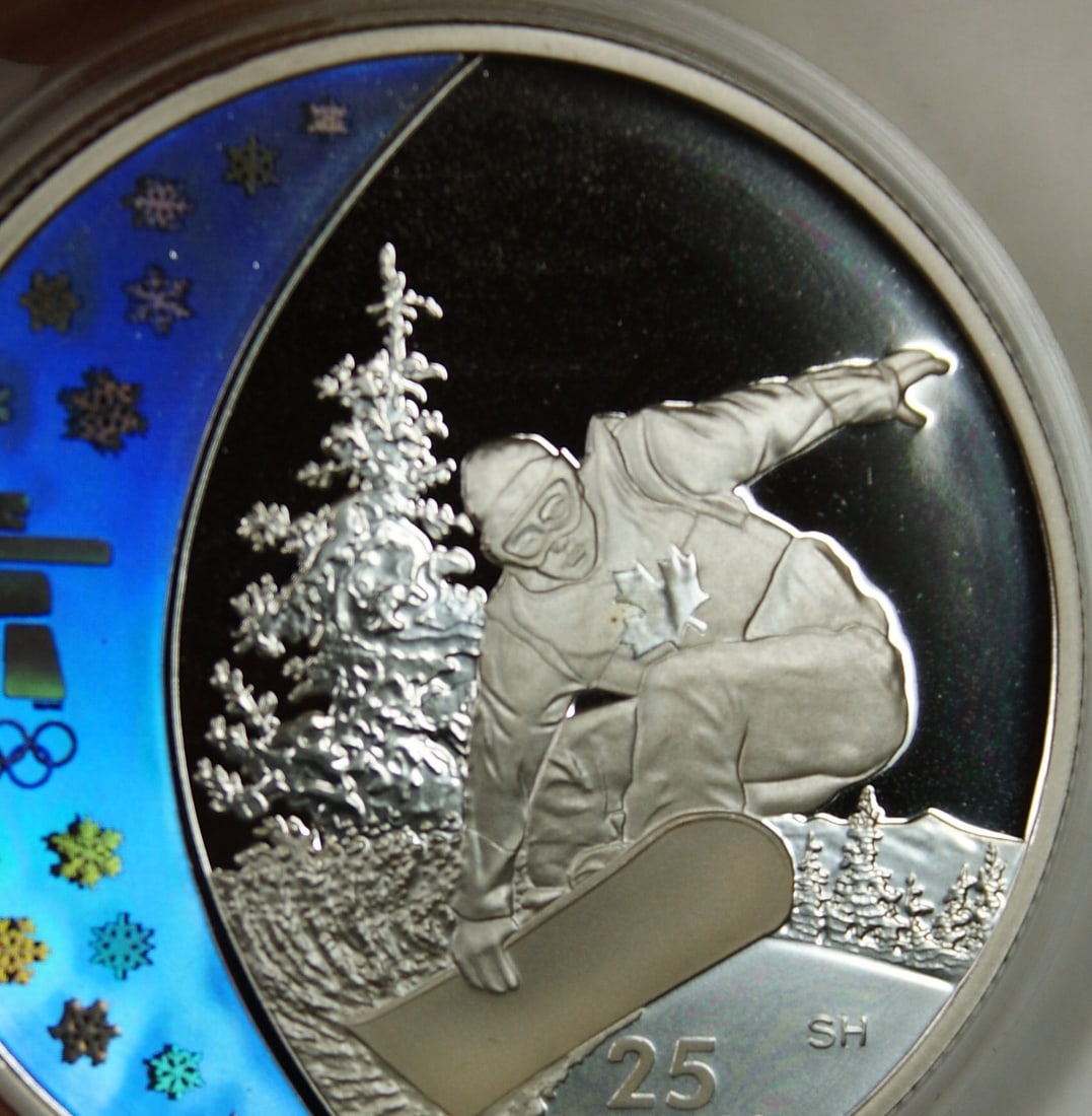 2008 Canada $25 Silver Coin 2010 Vancouver Holographic Snowboarding with Box COA: 2008 Canada $25 Silver Coin 2010 Vancouver Holographic Snowboarding with Box COA This 2008 Canada $25 Silver Coin commemorates the 2010 Vancouver Winter Olympics, featuring a holographic design showca