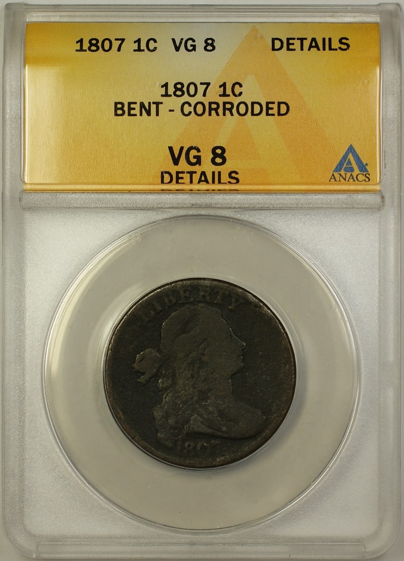 1807 Draped Bust 1c Coin ANACS VG8 Bent Corroded Rotated Reverse: 1807 Draped Bust 1c Coin ANACS VG8 Bent Corroded Rotated Reverse This 1807 Draped Bust Cent is a classic piece of American numismatic history. Struck at the Philadelphia mint, this coin features a bea