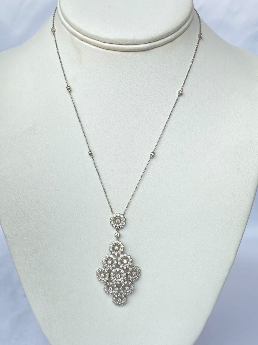 Tiffany & Co Platinum Diamond Flower Pendant Necklace with Box and Bag: Tiffany & Co Platinum Diamond Flower Pendant Necklace with Box and Bag Elevate your elegance with this stunning Tiffany & Co. platinum and diamond flower pendant necklace. Crafted with a base metal of