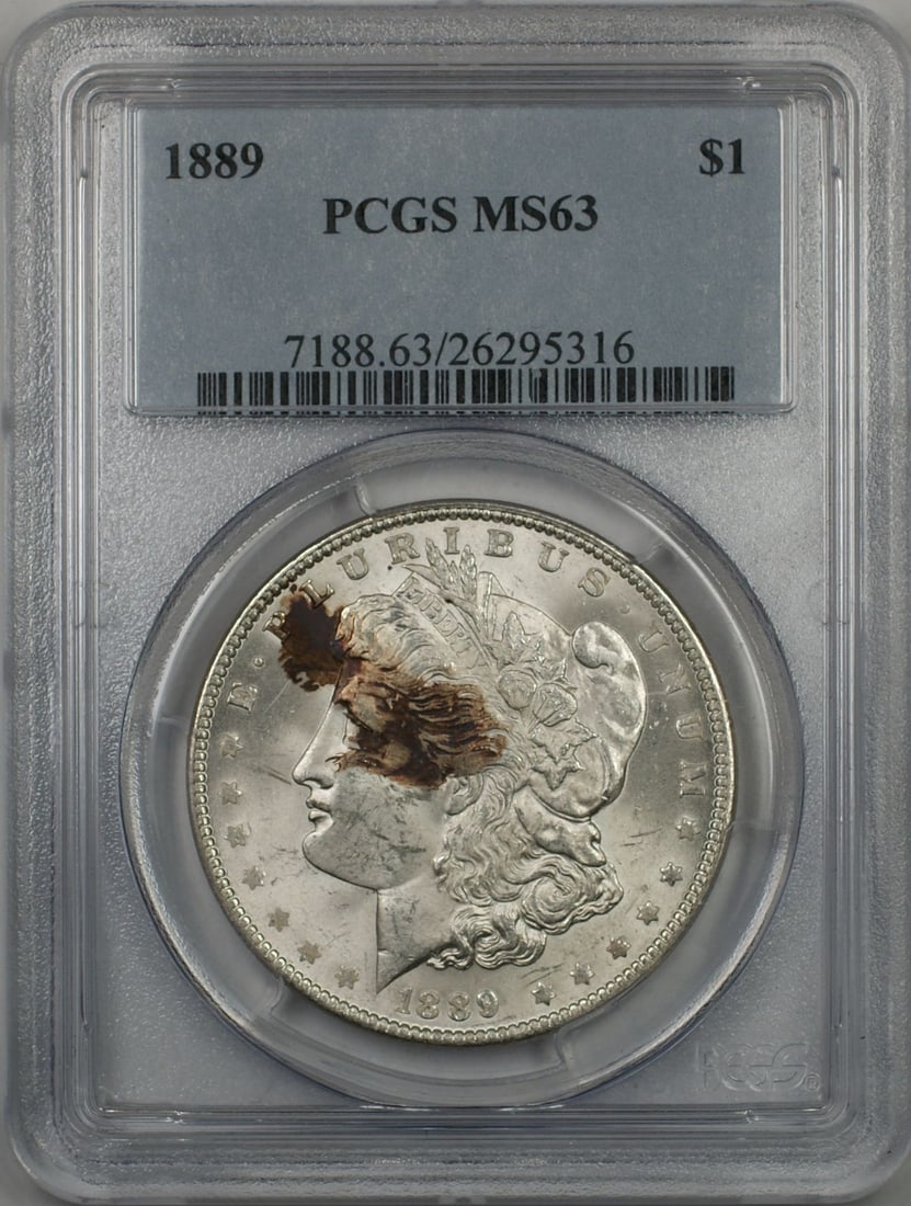 1889 Morgan Silver Dollar PCGS MS-63 Uncirculated Silver Coin: 1889 Morgan Silver Dollar PCGS MS-63 Uncirculated Silver Coin This 1889 Morgan Silver Dollar is a stunning example for collectors, certified by PCGS with a high grade of MS 63. Struck in Philadelphia,