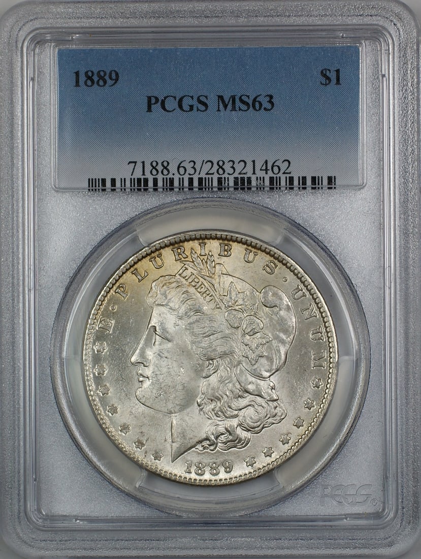 1889 Morgan Silver Dollar Coin PCGS MS63 Uncirculated Silver: 1889 Morgan Silver Dollar Coin PCGS MS63 Uncirculated Silver This 1889 Morgan Silver Dollar is a stunning piece, certified by PCGS with a grade of MS 63. It was minted in Philadelphia and features a c