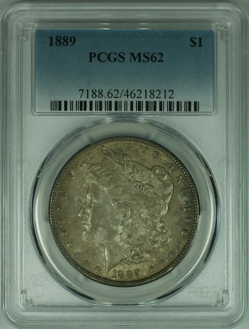 1889 Morgan Silver Dollar Coin PCGS MS62 Toned Uncirculated: 1889 Morgan Silver Dollar Coin PCGS MS62 Toned Uncirculated This 1889 Morgan Silver Dollar coin is a stunning example of American numismatic history. Graded MS-62 by PCGS, this uncirculated coin featu