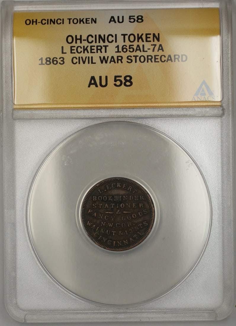 1863 Civil War L Eckert Cincinnati Storecard Token ANACS AU 58: 1863 Civil War L Eckert Cincinnati Storecard Token ANACS AU 58 This 1863 Civil War storecard token from L Eckert in Cincinnati, Ohio, is a remarkable collectible piece. Certified by ANACS with a grade