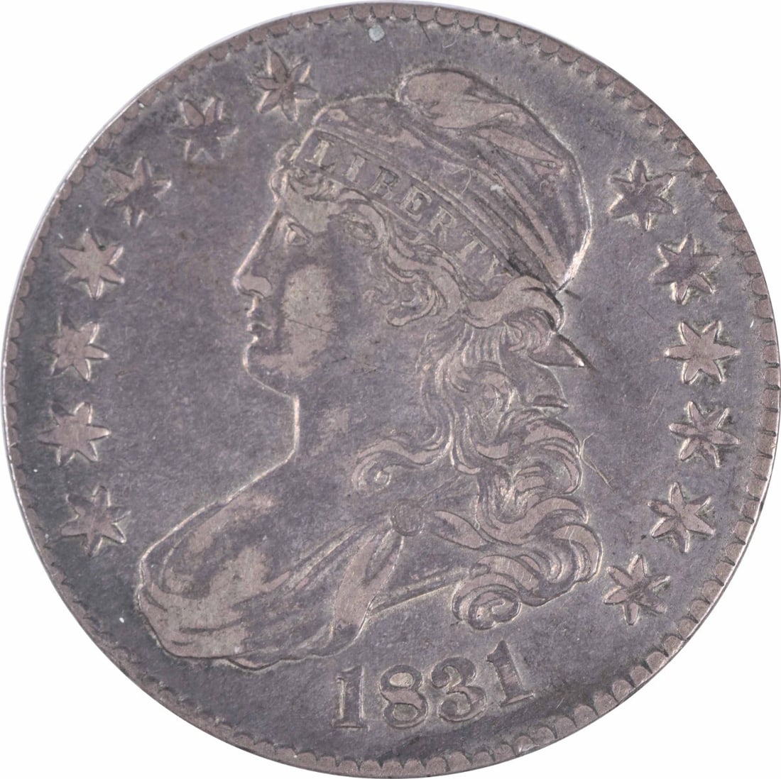 1831 Bust Silver Half Dollar 50C by John Reich Uncertified Coin: 1831 Bust Silver Half Dollar 50C by John Reich Uncertified Coin This 1831 Bust Silver Half Dollar features a striking design by John Reich, showcasing the classic bust of Liberty. It is a circulated c