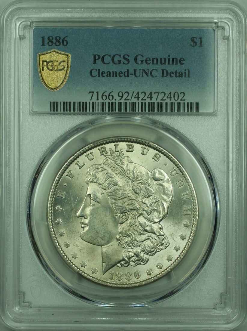 1886 Morgan Silver Dollar $1 Coin PCGS Genuine UNC Cleaned: 1886 Morgan Silver Dollar $1 Coin PCGS Genuine UNC Cleaned This 1886 Morgan Silver Dollar is a stunning piece certified by PCGS as Genuine and features UNC Cleaned Detail. Minted in Philadelphia, this