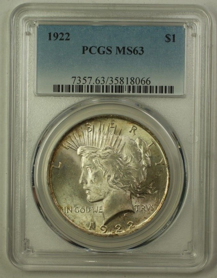 1922 US Silver Peace Dollar $1 Coin PCGS MS63 Toned Uncirculated: 1922 US Silver Peace Dollar $1 Coin PCGS MS63 Toned Uncirculated This 1922 US Silver Peace Dollar is a stunning collectible coin certified by PCGS with a grade of MS-63. Struck at the Philadelphia min