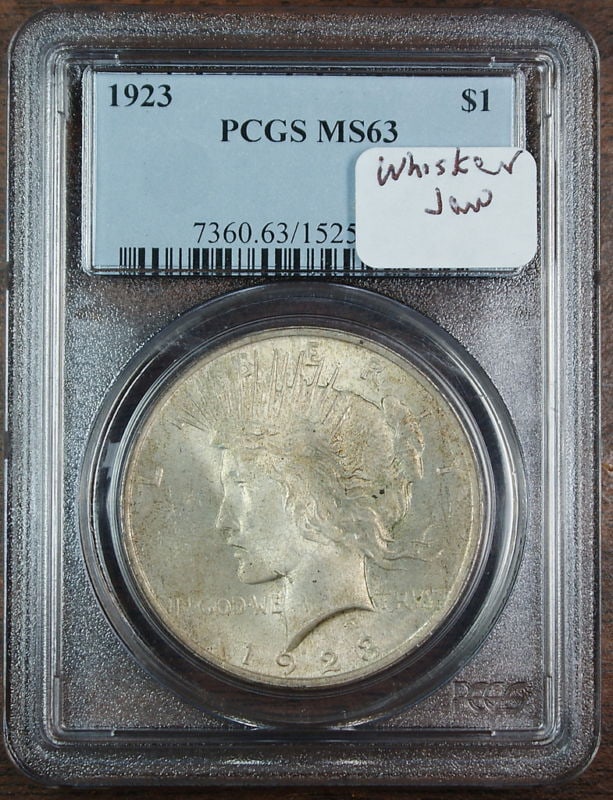 1923 Peace Silver Dollar PCGS MS63 Whisker Jaw VAM Uncirculated: 1923 Peace Silver Dollar PCGS MS63 Whisker Jaw VAM Uncirculated This 1923 Peace Silver Dollar is a remarkable piece certified by PCGS with a grade of MS-63, indicating it is in uncirculated condition.