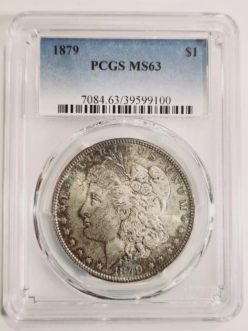 1879 P Morgan Silver Dollar PCGS MS63 Blue Toning: 1879 P Morgan Silver Dollar PCGS MS63 Blue Toning This 1879 P Morgan Silver Dollar is a stunning piece certified by PCGS with a grade of MS-63. Featuring beautiful blue toning, this uncirculated coin