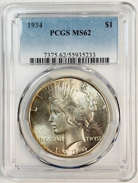 PCGS MS62 1934 Philadelphia Peace Silver Dollar: PCGS MS62 1934 Philadelphia Peace Silver Dollar This is a 1934 Peace Dollar coin from the Philadelphia Mint, certified by PCGS with a grade of MS-62. The coin is composed of silver and is in uncircula