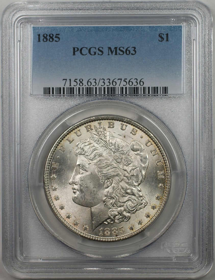 1885 Morgan Silver Dollar Coin PCGS MS63 Uncirculated: 1885 Morgan Silver Dollar Coin PCGS MS63 Uncirculated This 1885 Morgan Silver Dollar coin features exquisite detail and is certified by PCGS with a grade of MS-63, indicating its uncirculated conditio