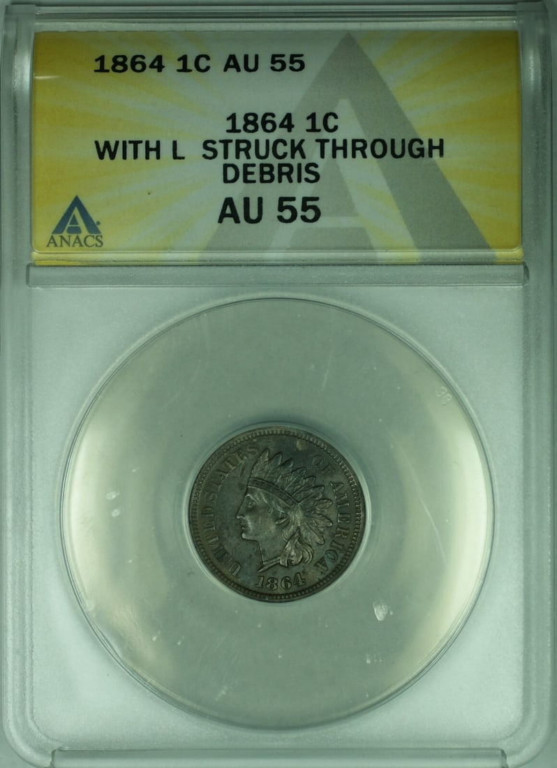 1864 Indian Head Cent 1c ANACS AU-55 Struck Through Debris: 1864 Indian Head Cent 1c ANACS AU-55 Struck Through Debris This 1864 Indian Head Cent features a striking design and is certified by ANACS with a grade of AU 55. The coin is composed of copper and dis