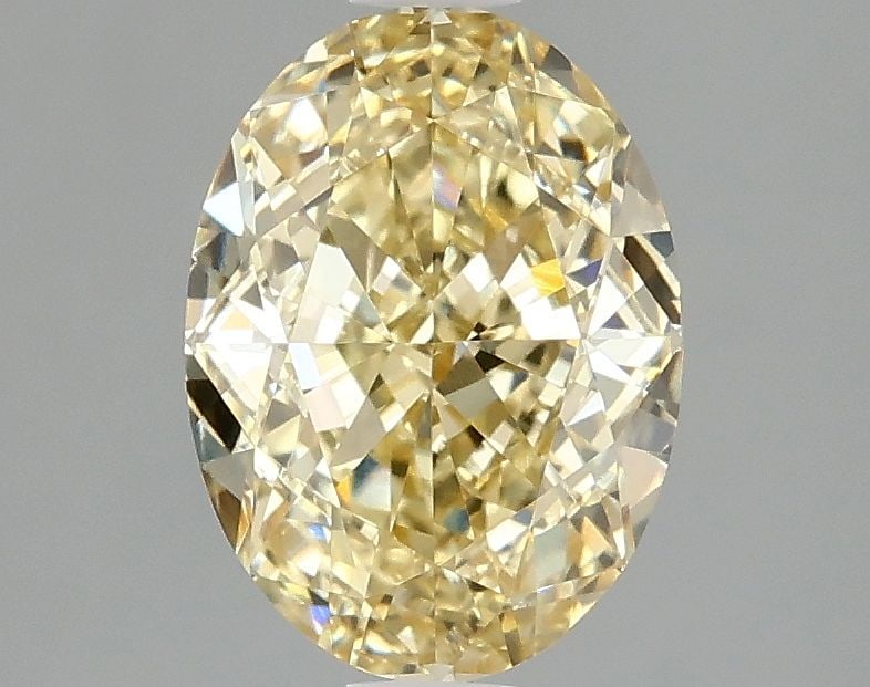 Loose Diamond - OVAL 2.1ct Fancy Intense Yellow VS1: Loose Diamond - OVAL 2.1ct Fancy Intense Yellow VS1 Source: This is a real non-mined Diamond that has been grown in a lab Shape: OVAL Carats: 2.1 Color: Fancy Intense Yellow Certification: IGI Video: