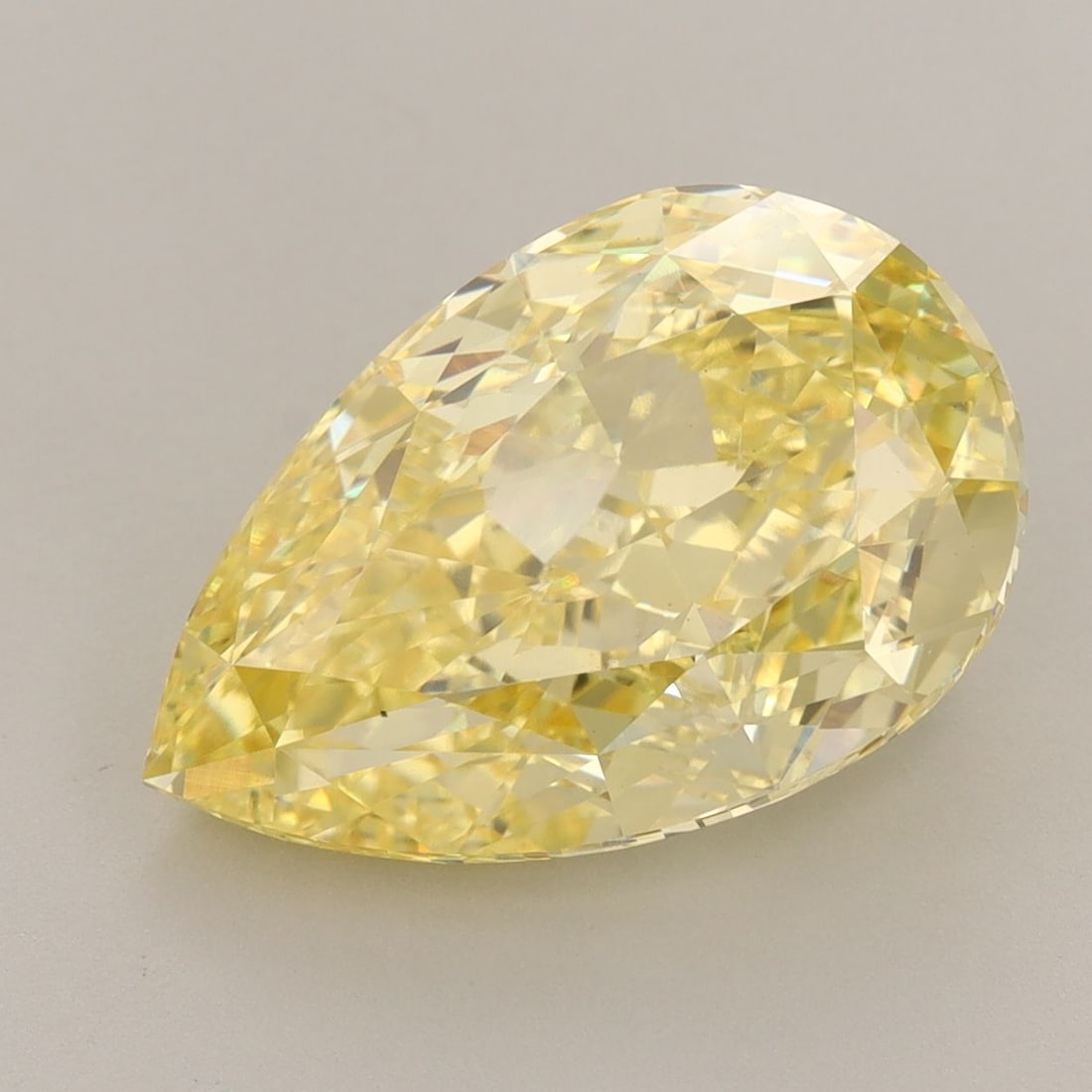 Loose Diamond - PEAR 7.02ct Fancy Vivid Yellow VS1: Loose Diamond - PEAR 7.02ct Fancy Vivid Yellow VS1 Source: This is a real non-mined Diamond that has been grown in a lab Shape: PEAR Carats: 7.02 Color: Fancy Vivid Yellow Certification: IGI Video: