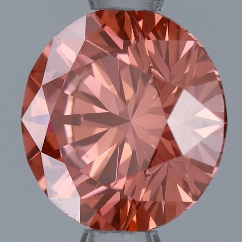 Ideal Loose Diamond - ROUND 1.04ct Fancy Vivid Pink VS1: Ideal Loose Diamond - ROUND 1.04ct Fancy Vivid Pink VS1 Source: This is a real non-mined Diamond that has been grown in a lab Shape: ROUND Carats: 1.04 Color: Fancy Vivid Pink Certification: IGI Video