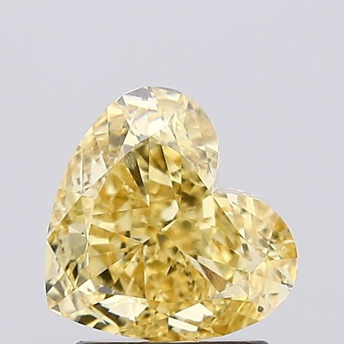 Loose Diamond - HEART 1.63ct Fancy Vivid Yellow VS1: Loose Diamond - HEART 1.63ct Fancy Vivid Yellow VS1 Source: This is a real non-mined Diamond that has been grown in a lab Shape: HEART Carats: 1.63 Color: Fancy Vivid Yellow Certification: IGI Video: