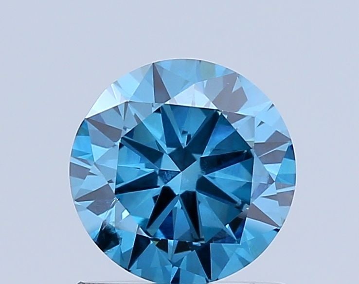 Loose Diamond - ROUND 0.91ct Fancy Vivid Blue SI2: Loose Diamond - ROUND 0.91ct Fancy Vivid Blue SI2 Source: This is a real non-mined Diamond that has been grown in a lab Shape: ROUND Carats: 0.91 Color: Fancy Vivid Blue Certification: NONE Video: