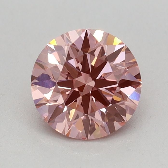 Ideal Loose Diamond - ROUND 0.6ct Fancy Vivid Pink VVS2: Ideal Loose Diamond - ROUND 0.6ct Fancy Vivid Pink VVS2 Source: This is a real non-mined Diamond that has been grown in a lab Shape: ROUND Carats: 0.6 Color: Fancy Vivid Pink Certification: IGI Video: