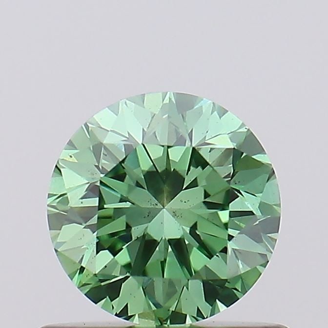 Loose Diamond - ROUND 0.65ct Fancy Vivid Green VS2: Loose Diamond - ROUND 0.65ct Fancy Vivid Green VS2 Source: This is a real non-mined Diamond that has been grown in a lab Shape: ROUND Carats: 0.65 Color: Fancy Vivid Green Certification: IGI Video: