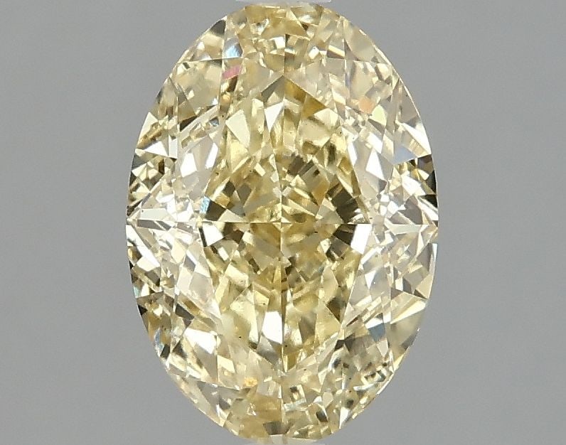 Loose Diamond - OVAL 2.1ct Fancy Vivid Yellow VS2: Loose Diamond - OVAL 2.1ct Fancy Vivid Yellow VS2 Source: This is a real non-mined Diamond that has been grown in a lab Shape: OVAL Carats: 2.1 Color: Fancy Vivid Yellow Certification: IGI Video: