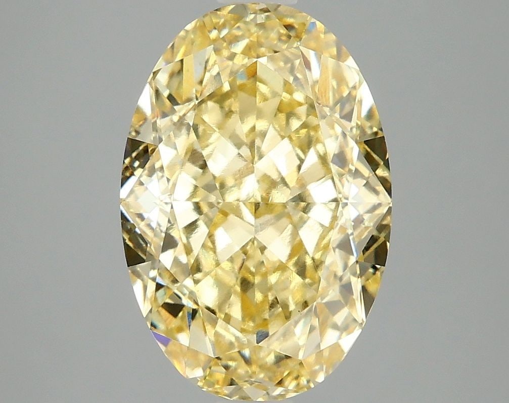 Loose Diamond - OVAL 4.09ct Fancy Vivid Yellow VVS2: Loose Diamond - OVAL 4.09ct Fancy Vivid Yellow VVS2 Source: This is a real non-mined Diamond that has been grown in a lab Shape: OVAL Carats: 4.09 Color: Fancy Vivid Yellow Certification: IGI Video: