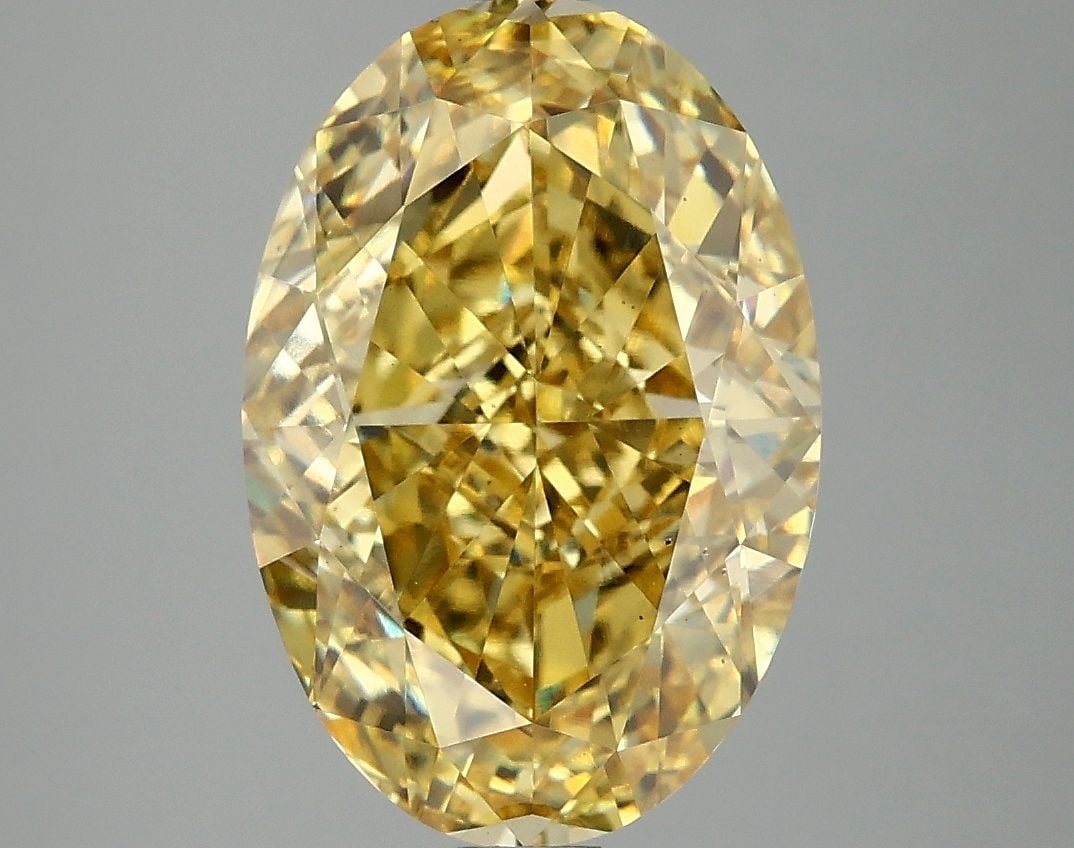 Loose Diamond - OVAL 5.07ct Fancy Vivid Yellow VS2: Loose Diamond - OVAL 5.07ct Fancy Vivid Yellow VS2 Source: This is a real non-mined Diamond that has been grown in a lab Shape: OVAL Carats: 5.07 Color: Fancy Vivid Yellow Certification: IGI Video: