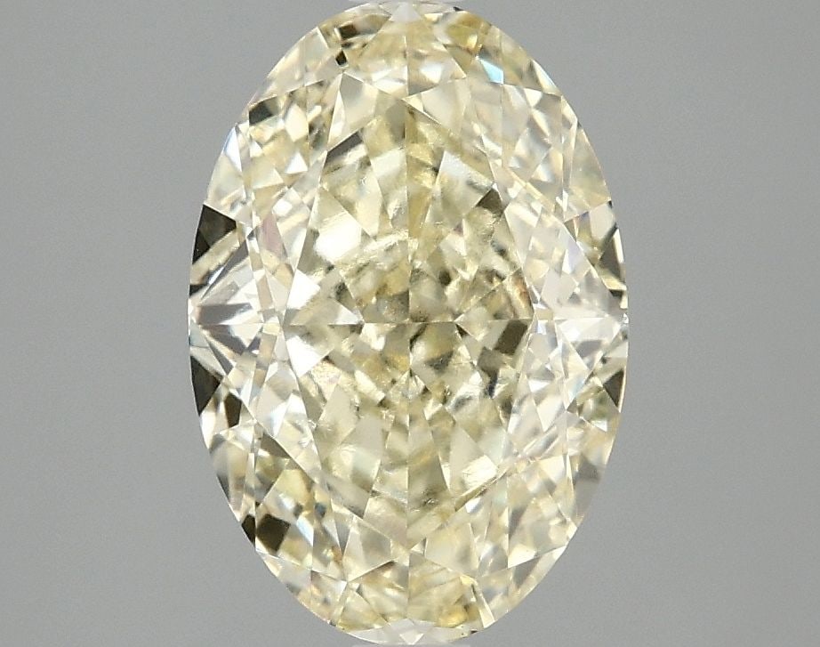 Loose Diamond - OVAL 3.09ct Fancy Vivid Yellow VVS2: Loose Diamond - OVAL 3.09ct Fancy Vivid Yellow VVS2 Source: This is a real non-mined Diamond that has been grown in a lab Shape: OVAL Carats: 3.09 Color: Fancy Vivid Yellow Certification: IGI Video: