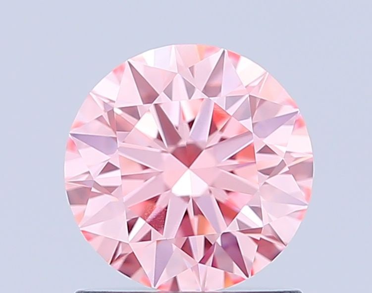 Ideal Loose Diamond - ROUND 1.01ct Fancy Vivid Pink VVS2: Ideal Loose Diamond - ROUND 1.01ct Fancy Vivid Pink VVS2 Source: This is a real non-mined Diamond that has been grown in a lab Shape: ROUND Carats: 1.01 Color: Fancy Vivid Pink Certification: IGI Vide