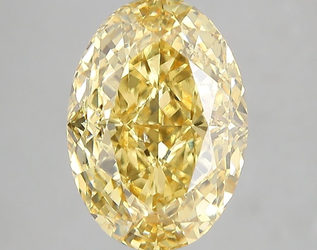 Loose Diamond - OVAL 5.03ct Fancy Vivid Yellow SI1: Loose Diamond - OVAL 5.03ct Fancy Vivid Yellow SI1 Source: This is a real non-mined Diamond that has been grown in a lab Shape: OVAL Carats: 5.03 Color: Fancy Vivid Yellow Certification: IGI Video: