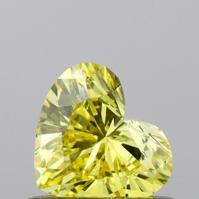Loose Diamond - HEART 0.42ct Fancy Vivid Yellow VS2: Loose Diamond - HEART 0.42ct Fancy Vivid Yellow VS2 Source: This is a real non-mined Diamond that has been grown in a lab Shape: HEART Carats: 0.42 Color: Fancy Vivid Yellow Certification: IGI Video: