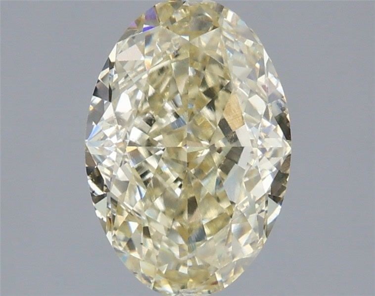 Loose Diamond - OVAL 2.1ct Fancy Light Yellow VVS2: Loose Diamond - OVAL 2.1ct Fancy Light Yellow VVS2 Source: This is a real non-mined Diamond that has been grown in a lab Shape: OVAL Carats: 2.1 Color: Fancy Light Yellow Certification: IGI Video: