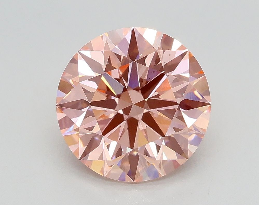 Ideal Loose Diamond - ROUND 2.01ct Fancy Vivid Pink VS2: Ideal Loose Diamond - ROUND 2.01ct Fancy Vivid Pink VS2 Source: This is a real non-mined Diamond that has been grown in a lab Shape: ROUND Carats: 2.01 Color: Fancy Vivid Pink Certification: IGI Video