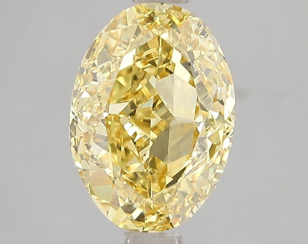 Loose Diamond - OVAL 3.01ct Fancy Vivid Yellow VS2: Loose Diamond - OVAL 3.01ct Fancy Vivid Yellow VS2 Source: This is a real non-mined Diamond that has been grown in a lab Shape: OVAL Carats: 3.01 Color: Fancy Vivid Yellow Certification: IGI Video: